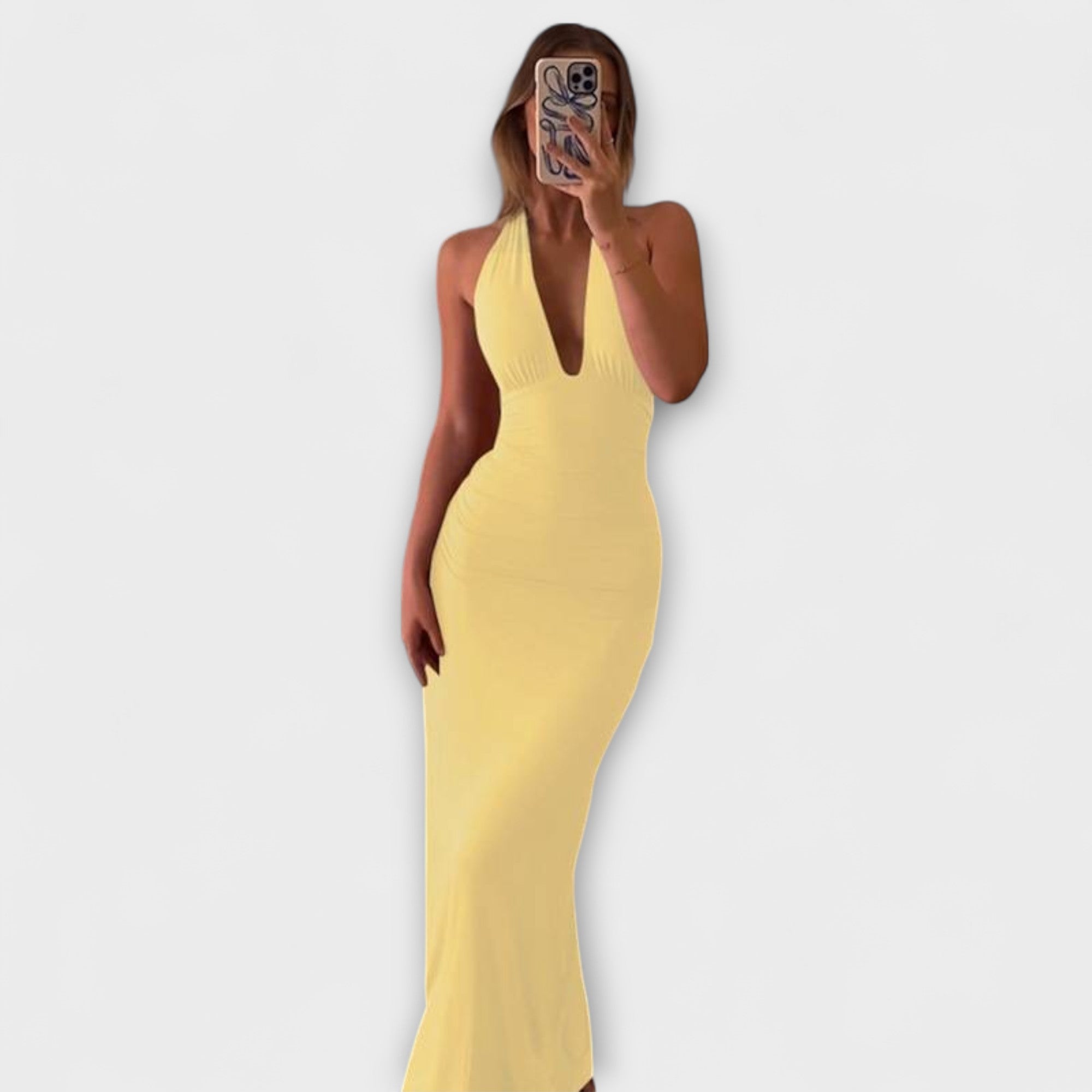 Sofistikerad rygglös halterneck galaklänning